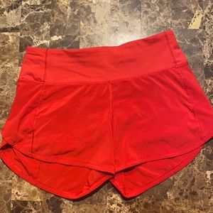 Red lululemon Speed Up Mid Rise shorts 4”